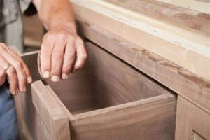 worker constructing beautifully made cabinets