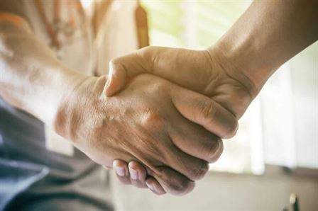 two people shaking hands