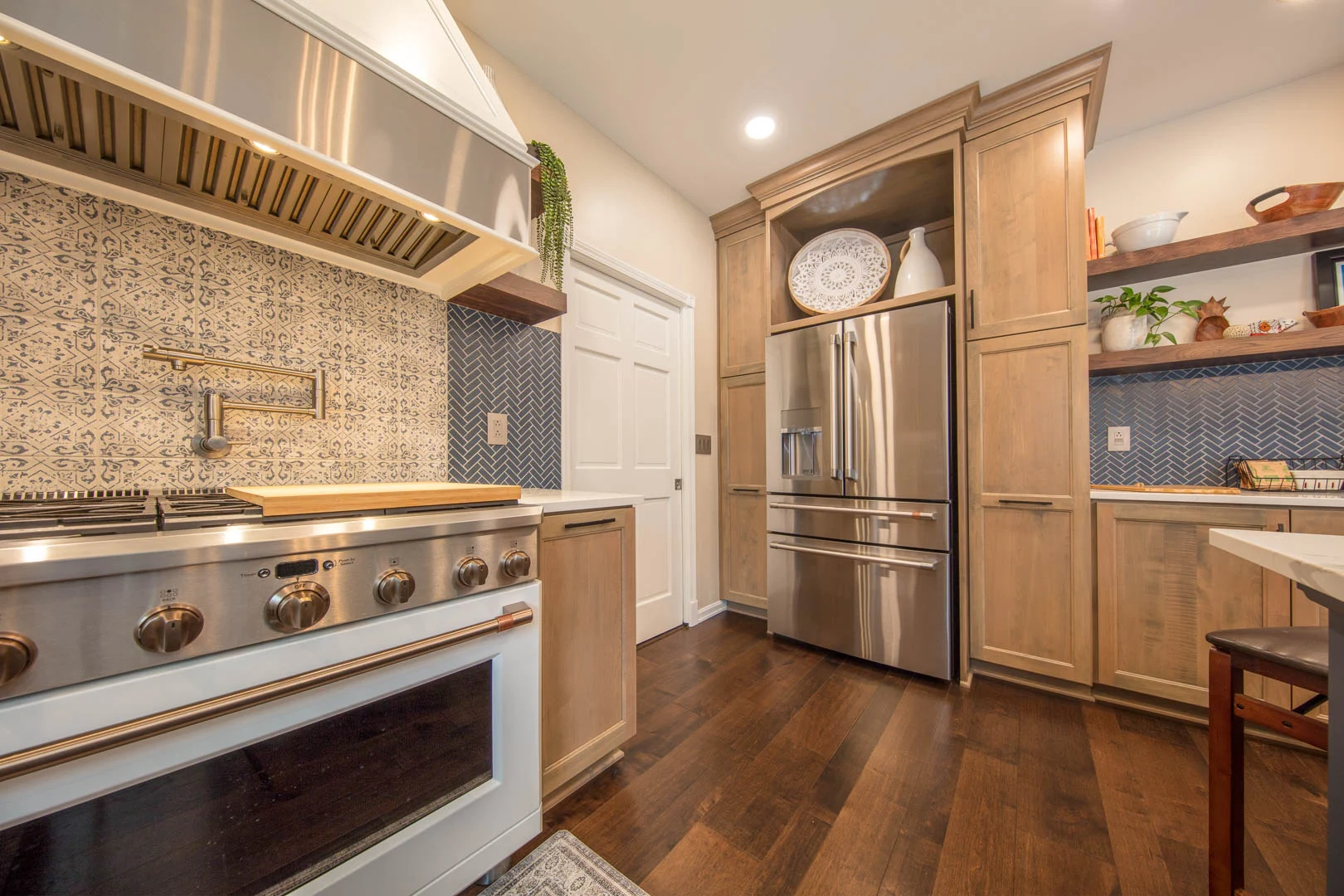 Kitchen with versatile maple cabinets and blue accents